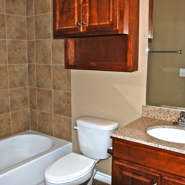 GraceLake-Towne-Homes-Beaumont-TX-bathroom-with-granite-counters
